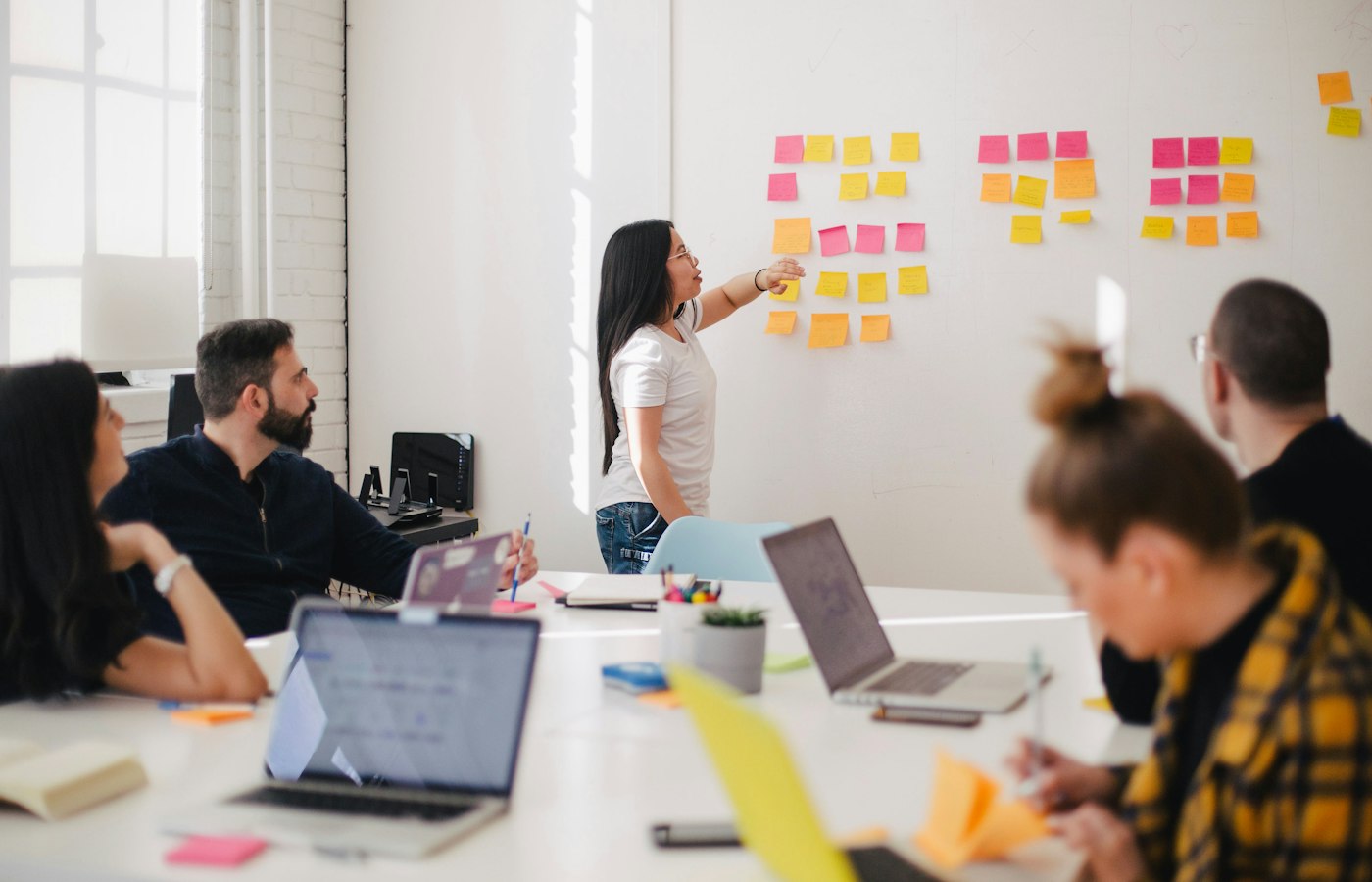 Team collaborating around a workshop table